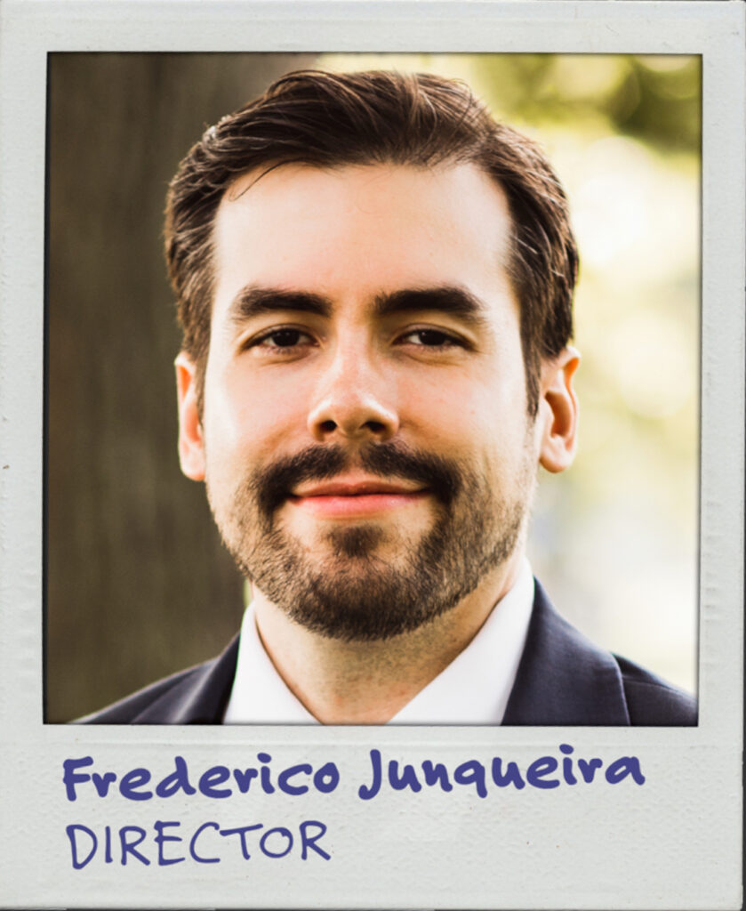 Portrait of a Brazilian man with brown hair and stubble in a suit. The text below reads: Frederico Junqueira. Director.